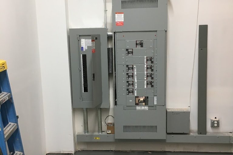 Commercial switchboard and lighting panel installed in a utility room