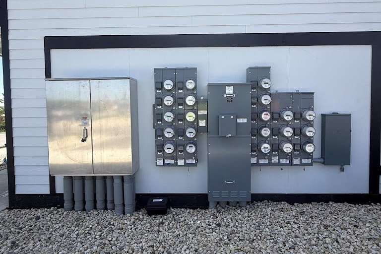 Multi unit electric meter bank and service equipment installed on a new apartment building