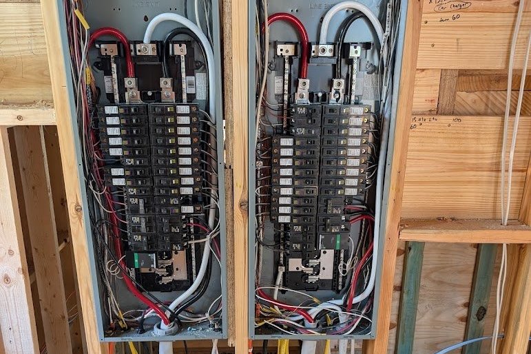 Two new residential electrical panels wired during new construction rough in